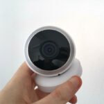 person holding budget cctv cameras
